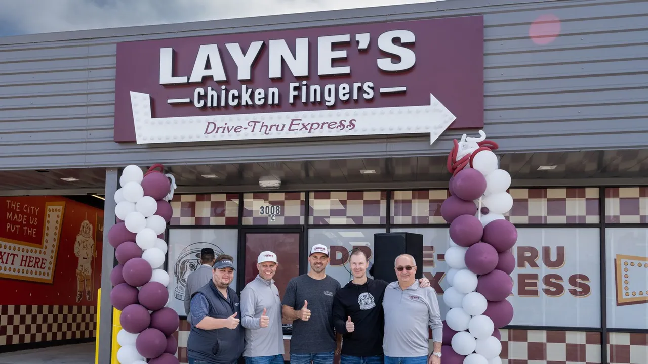 photo of five Layne's Chicken Fingers team members standing in front of new drive-thru only Layne's