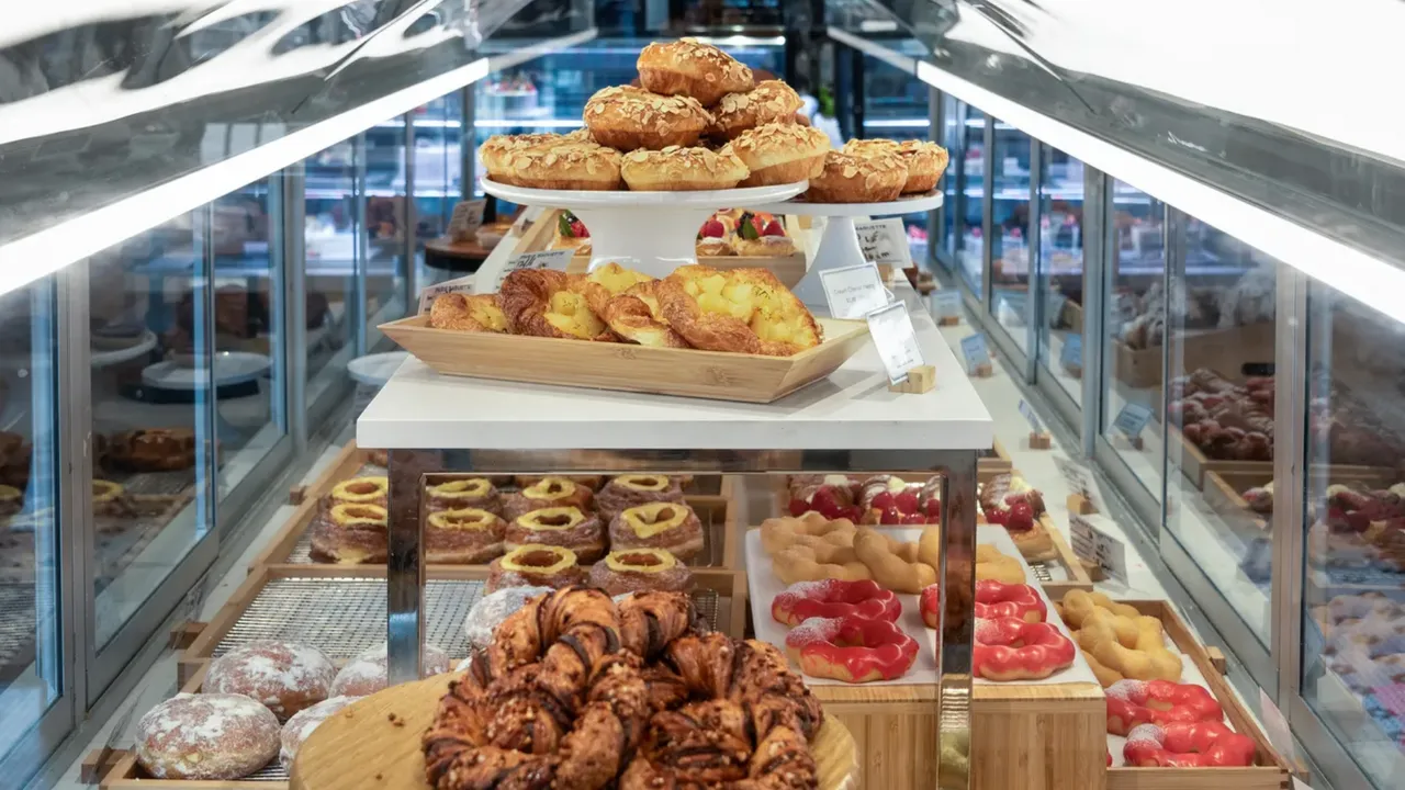 Photo of table of pastries and donuts in Paris Baguette