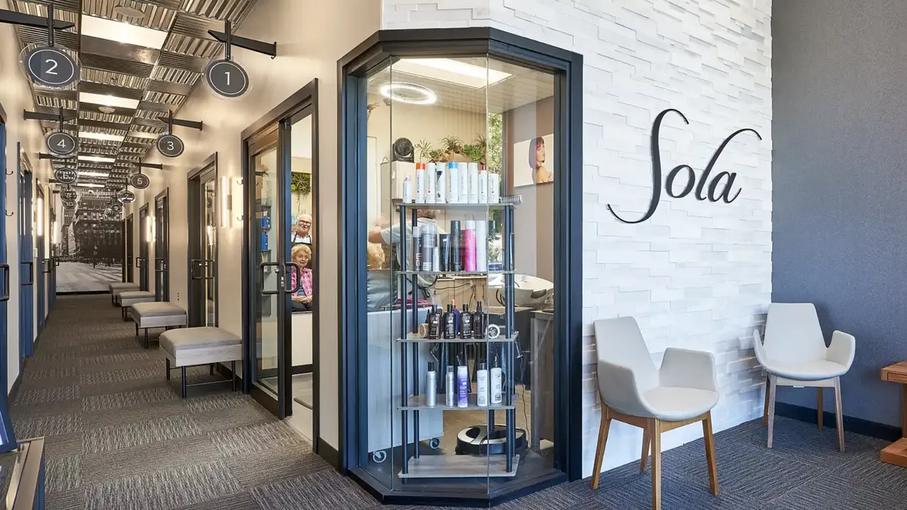 Photo of Sola Salons lobby area with retail display in window