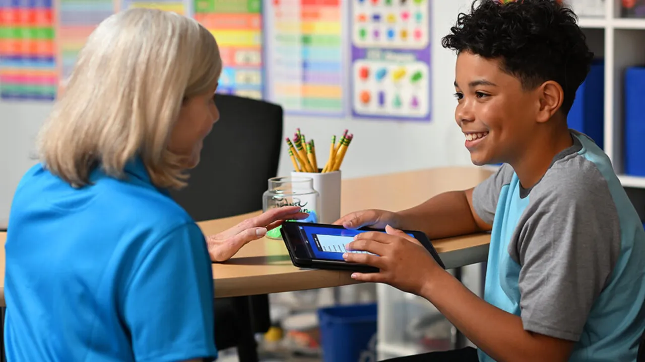 Photo of Sylvan Learning teacher and student sitting at table together