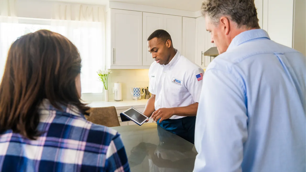 image of a benjamin franklin plumber employee helping a customer