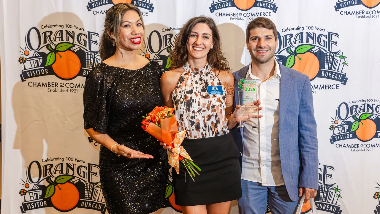 Minuteman Press Franchise Owner Luciana Lorenzo (center) at the 2025 Best of Orange Awards event.