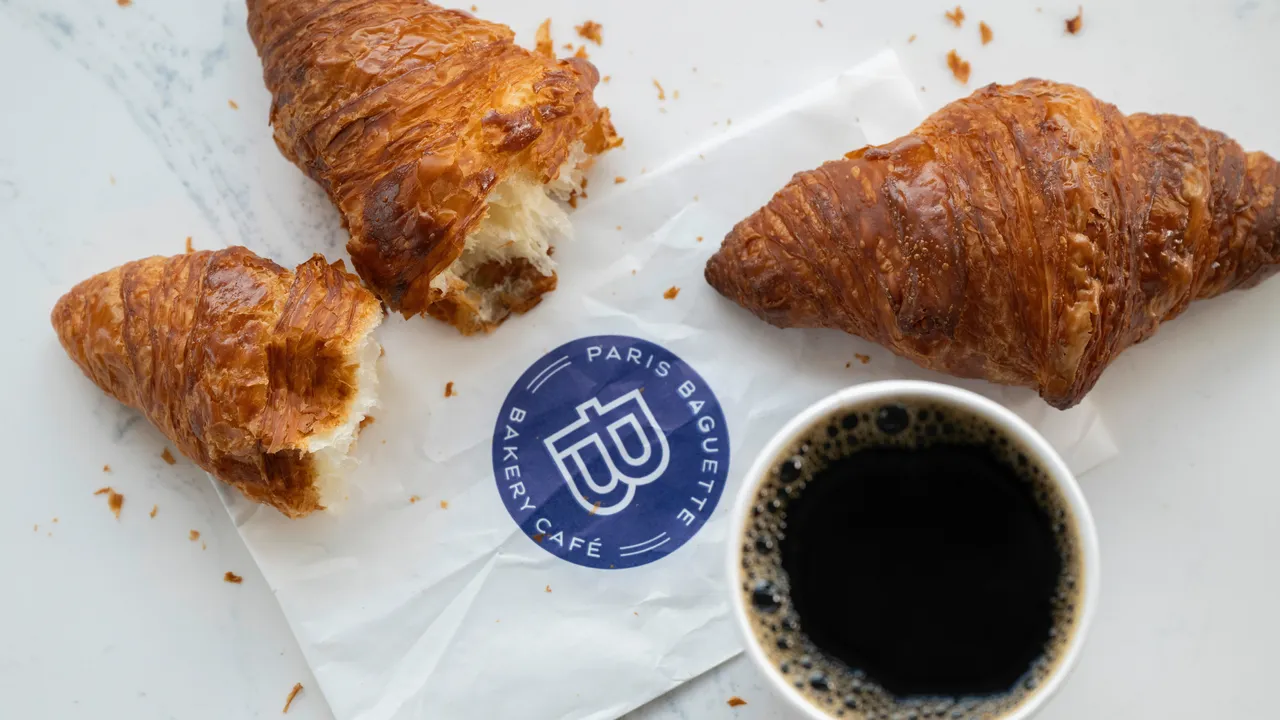 Photo of Paris Baguette croissants and cup of hot coffee