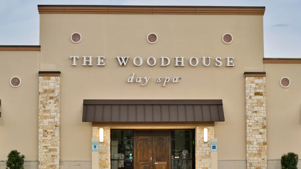 Photo of exterior of Woodhouse Spa location with wooden doors 