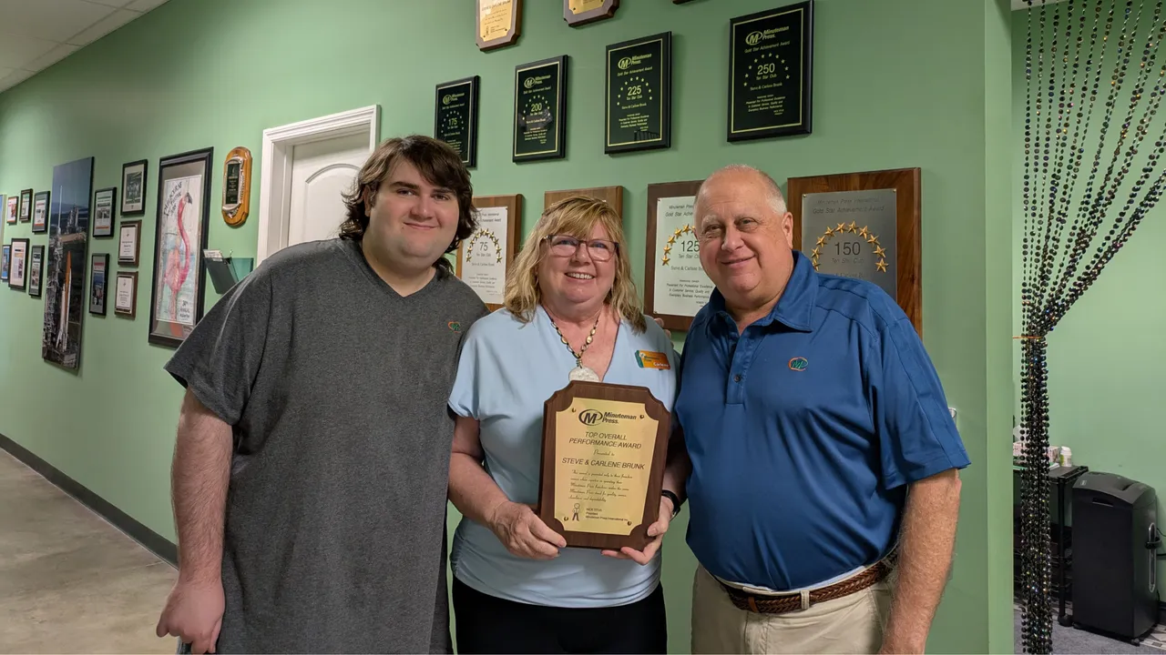 Minuteman Press franchise owners Shane, Carlene, and Steve Brunk, Treasure Coast, FL.