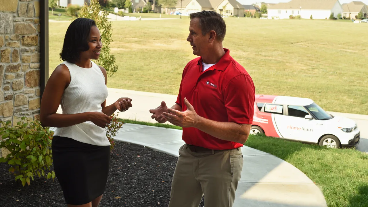 Photo of HomeTeam inspector speaking with another person
