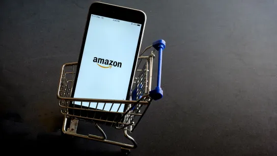 Amazon app on a phone in a mini shopping cart