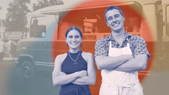 Photo of two young people standing in front of food truck