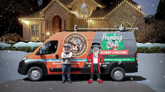 Photo of decorated home with Pest Hunters-Mosquito Hunters-Humbug Holiday Lighting van in front