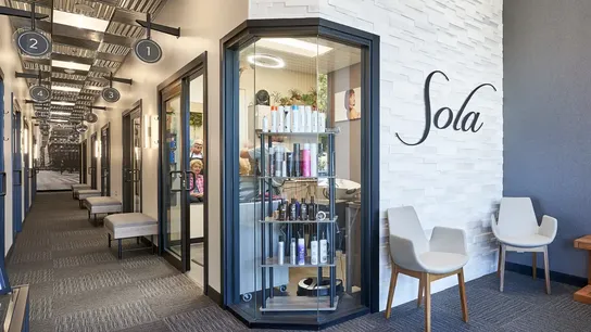Photo of Sola Salons lobby area with retail display in window