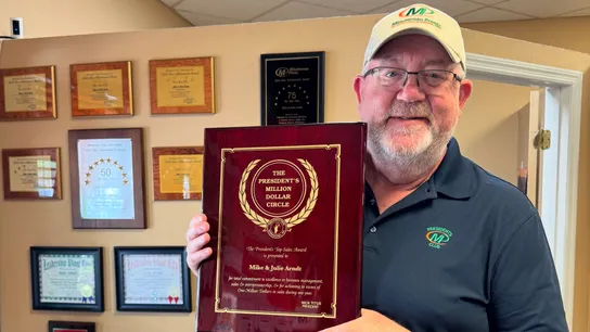 Minuteman Press Franchise Owner Mike Arndt with his President’s Club Award in Plant City, FL.