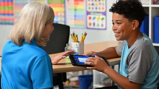 Photo of Sylvan Learning teacher and student sitting at table together