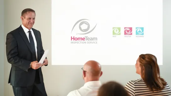Photo of HomeTeam Inspection Service representative giving presentation
