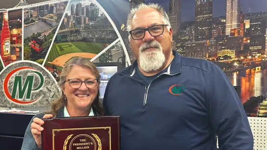 Minuteman Press Franchise Owners Danielle & Tony Colecchi with their President’s Club Award.