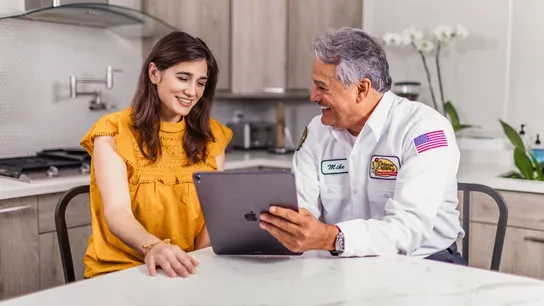 image of Mister sparky electric employee working with customer