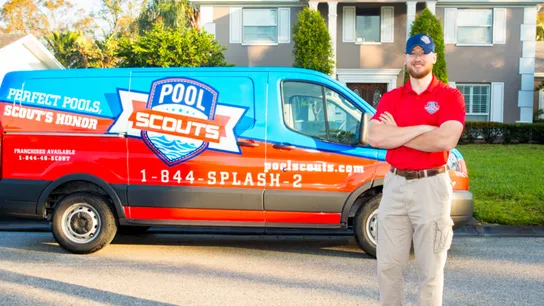 Photo of Pool Scouts team member standing outside branded van 