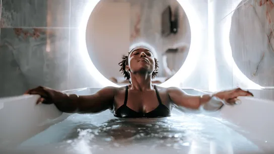 Image of a woman relaxing in a sweathous swthz tub