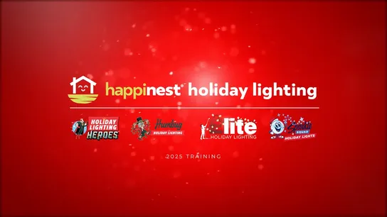 Photo of Humbug Holiday Lighting team members wearing festive sweaters, beanies, smiling at camera