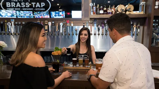 The Brass Tap franchise, people consuming alcohol, bartender