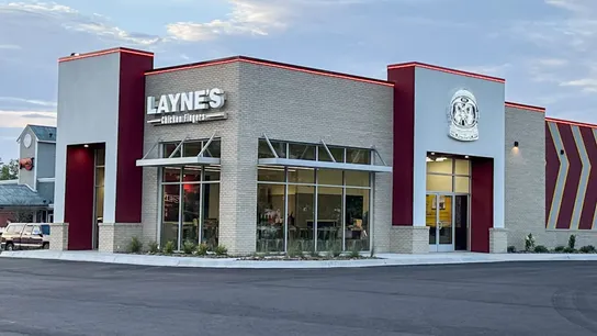 Photo of Layne's restaurant with red light around the top of the building