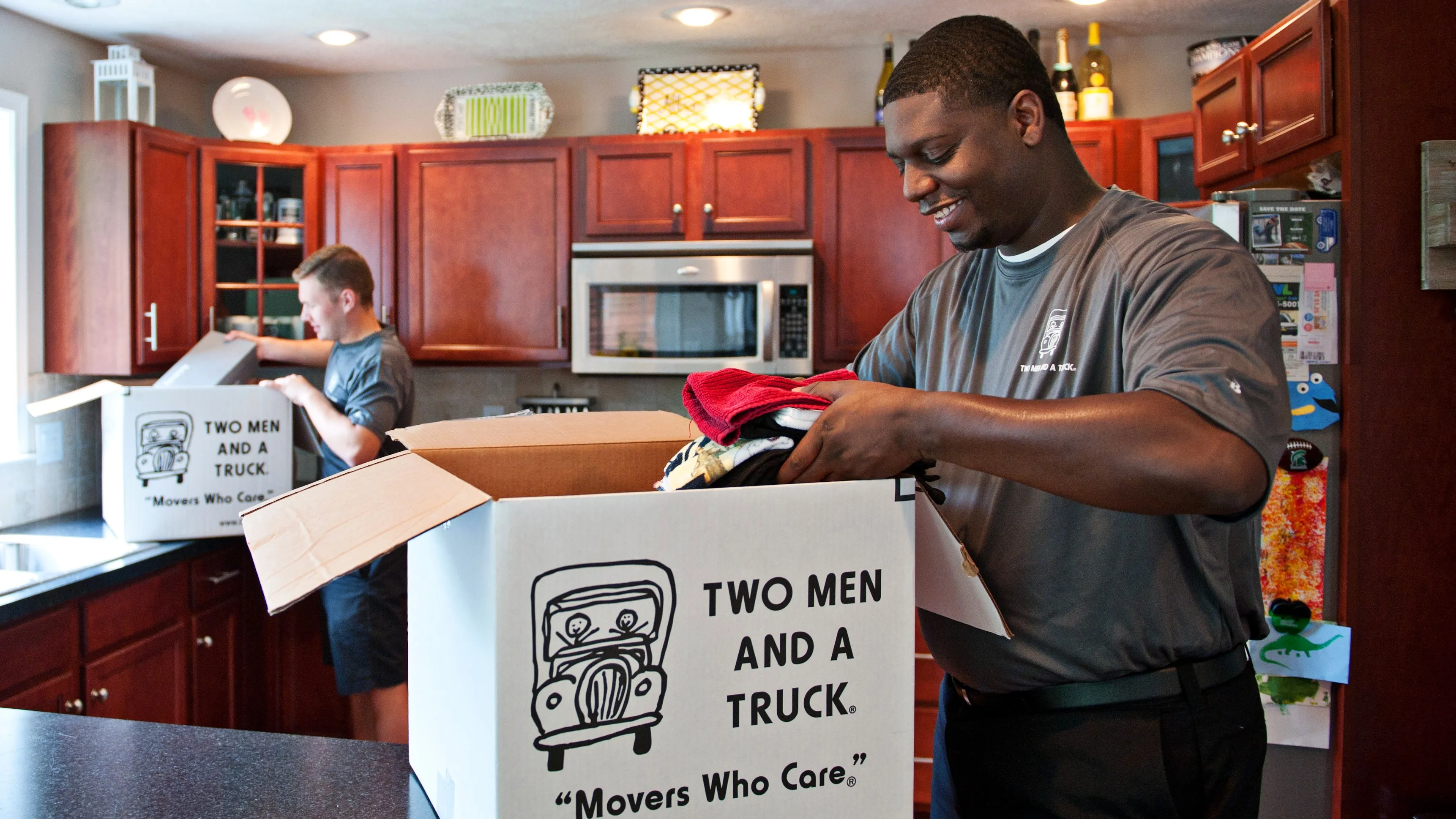 TWO MEN AND A TRUCK movers packing