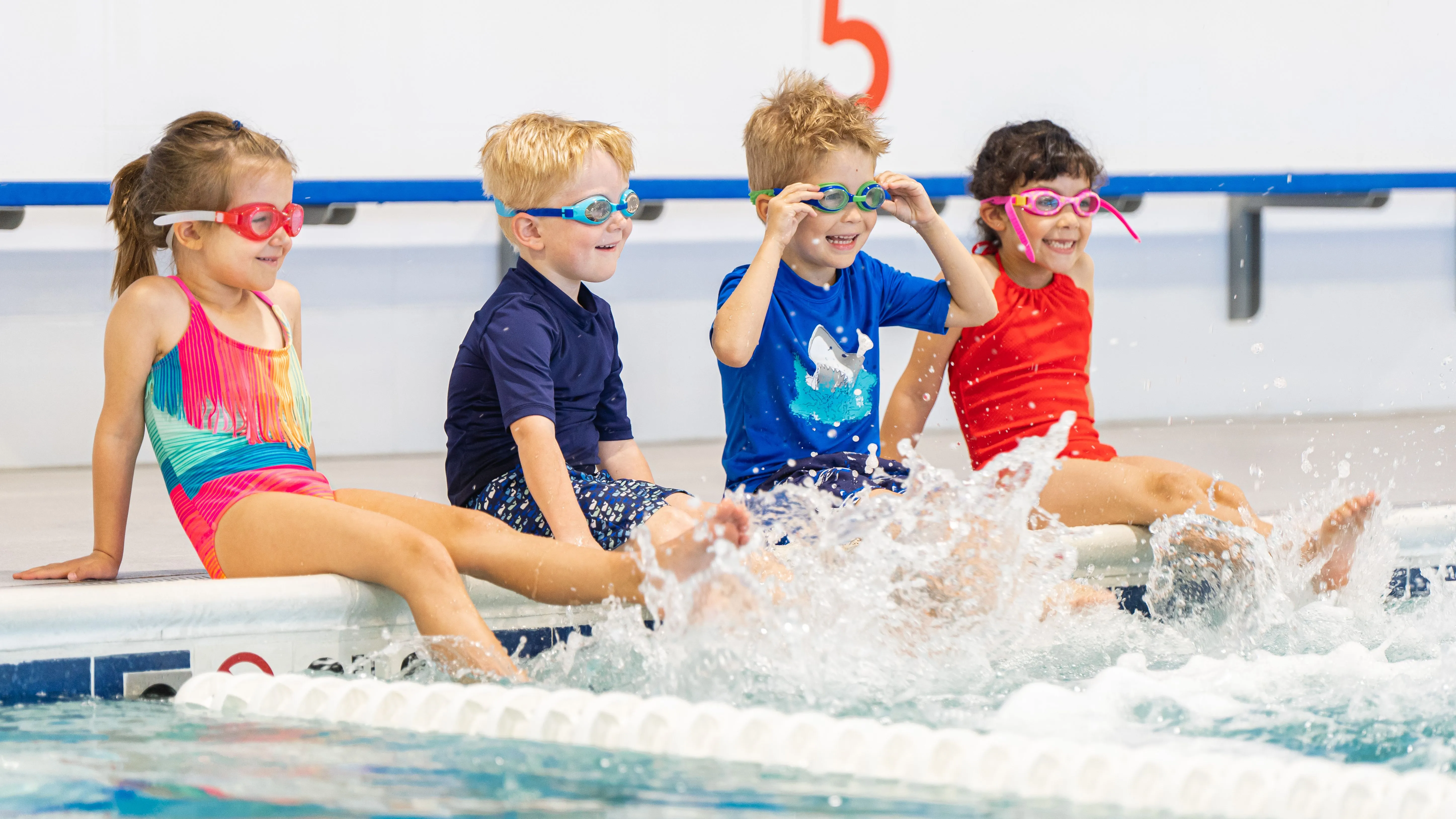 Students splashing at Big Blue Swim School