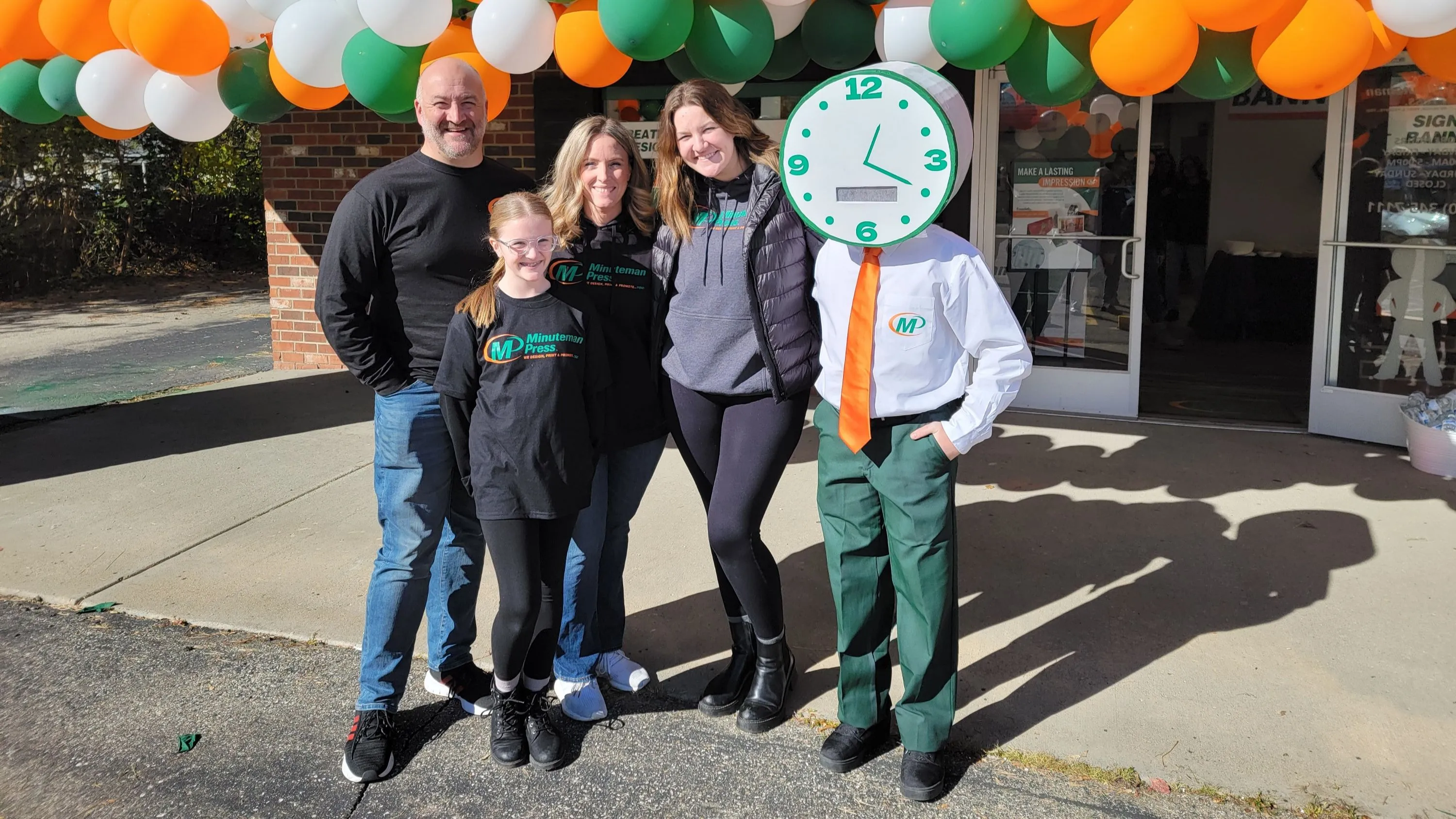 Minuteman Press franchise, Grand Blanc, MI: Mompreneur Samantha Hilliker (3rd from left) and family.