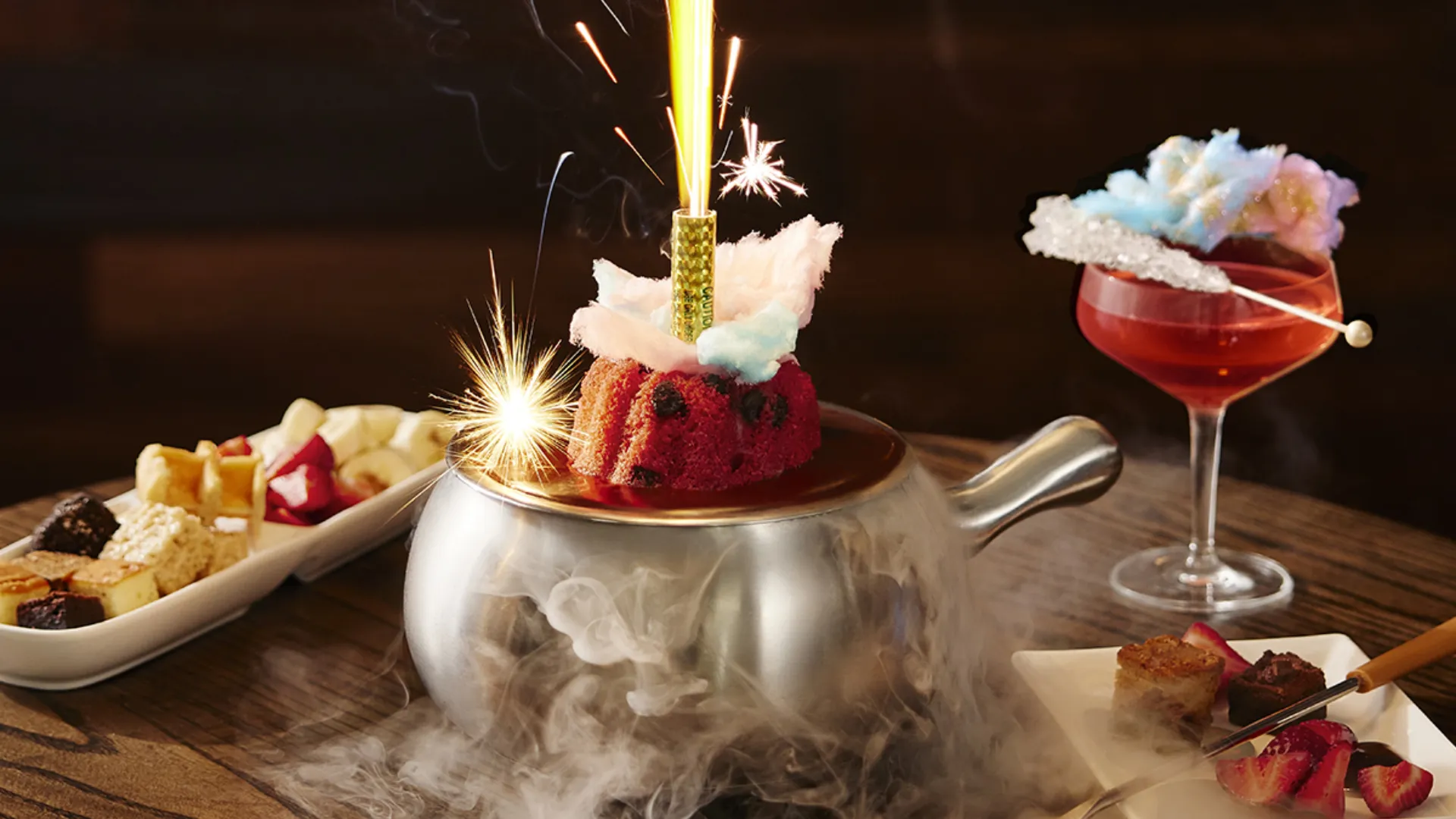 Melting Pot dessert fondue with cotton candy and a sparkler