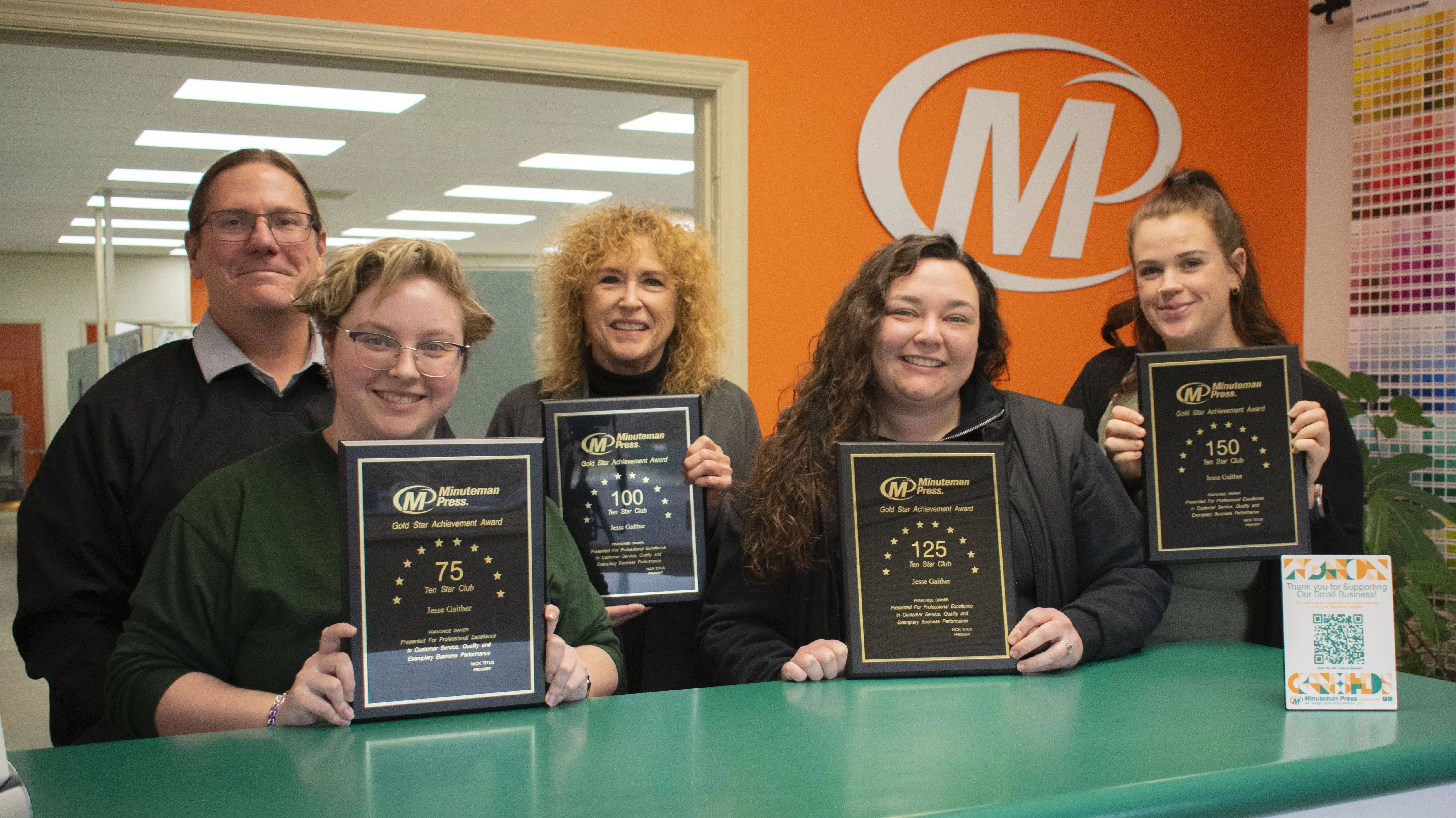 Minuteman Press franchise owner Jesse Gaither (left) and team, Centerville, Ohio.