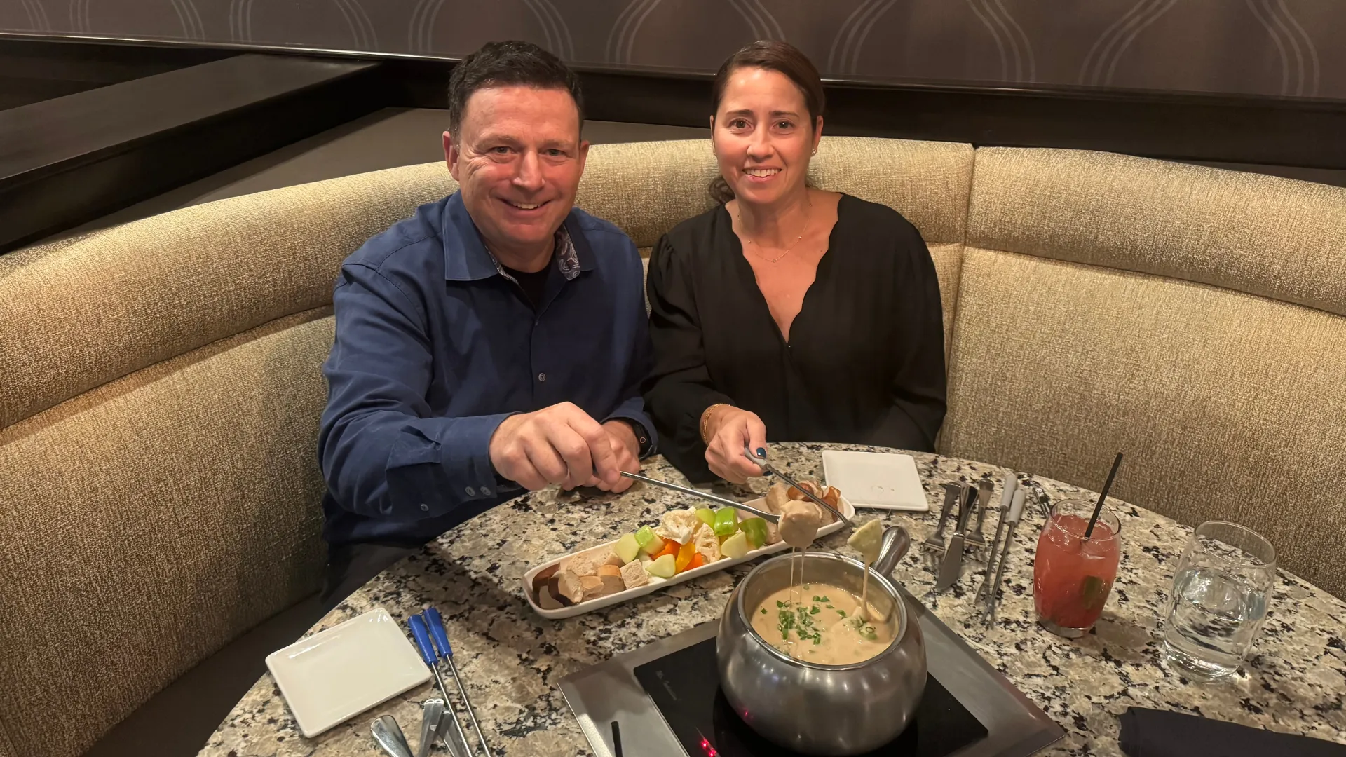 photo of Daina and Jonathan Reeve sharing a meal at a Melting Pot table