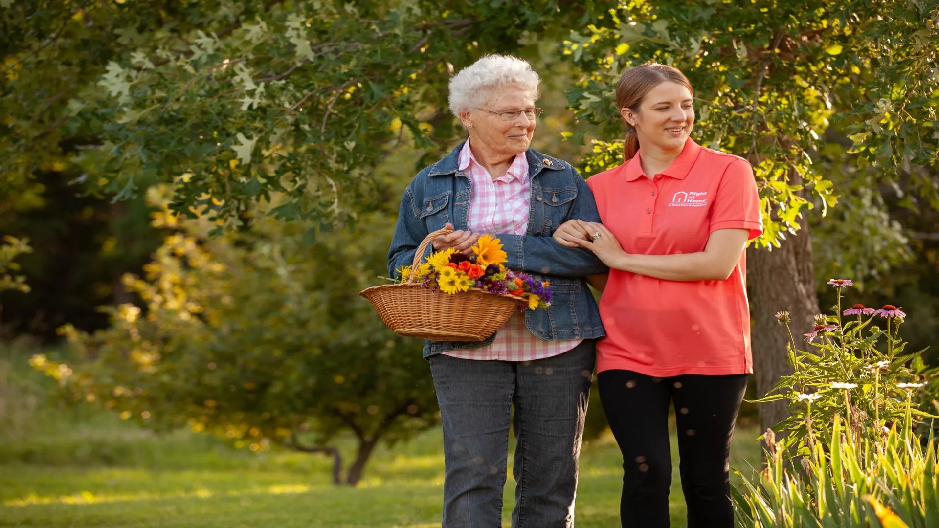 photo featuring Right at Home caregiver walking outdoors with a client