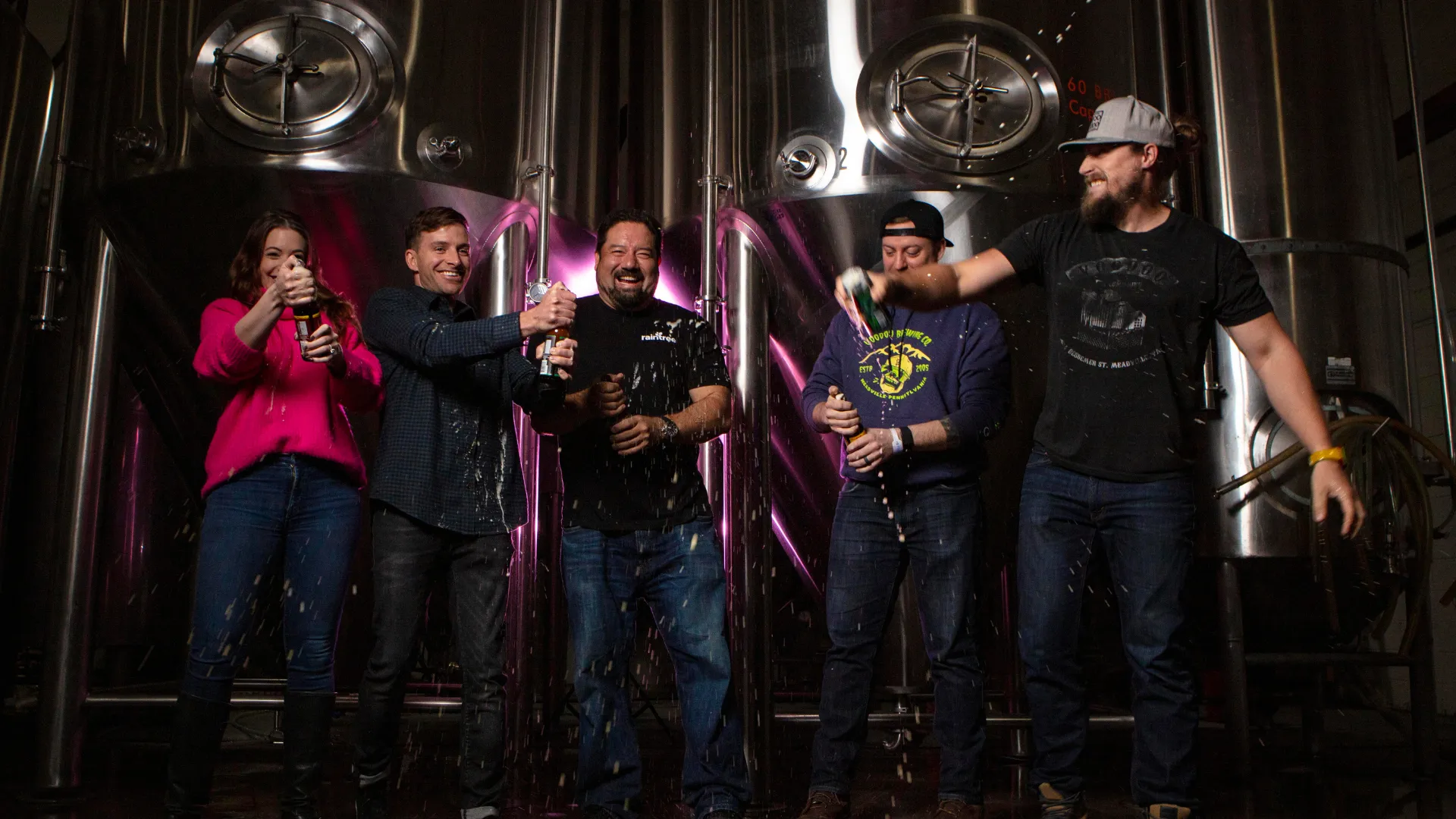 photo of five Voodoo Brewing Co. team members in brewery