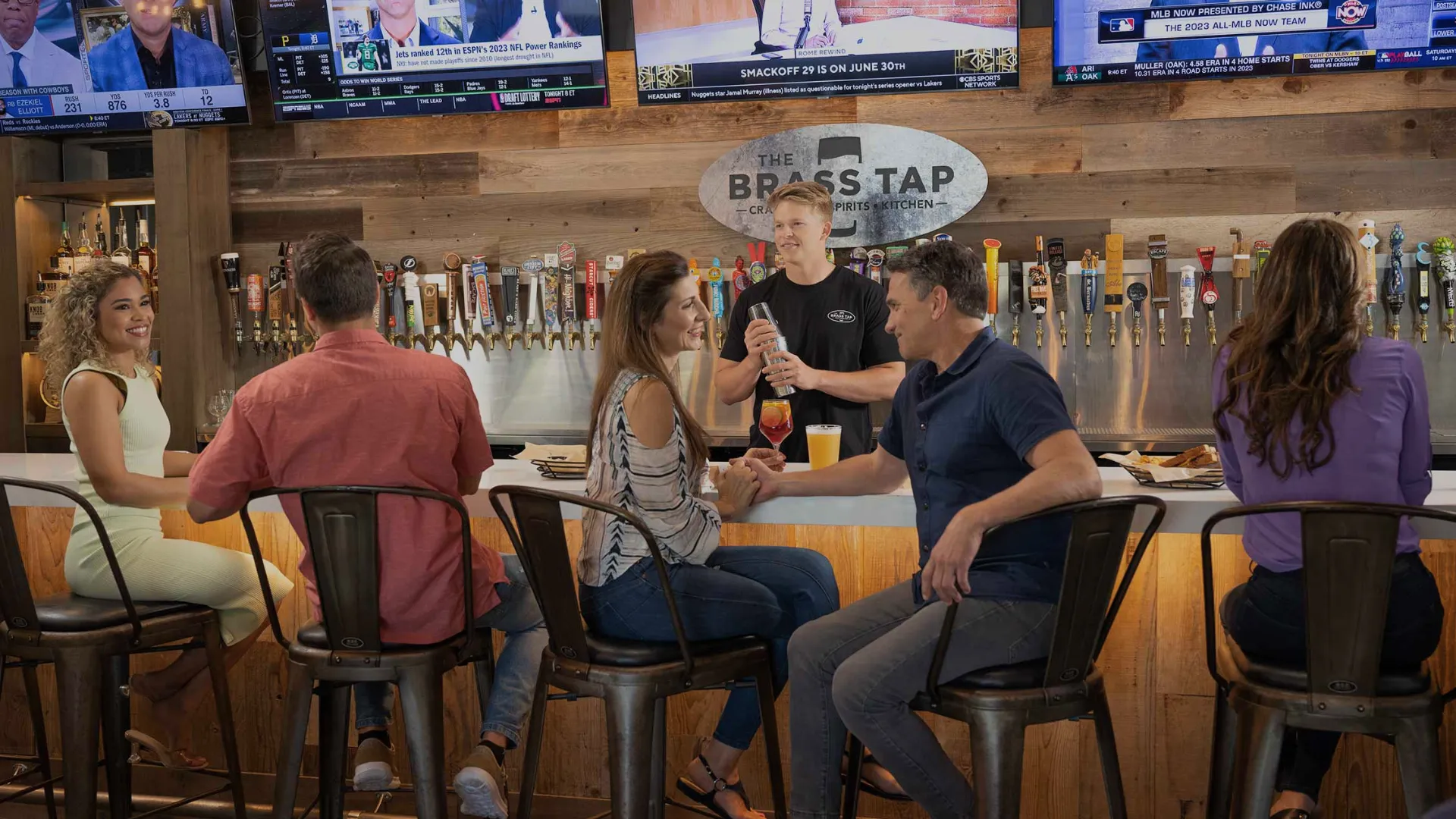 photo of multiple guests seated at Brass Tap bar