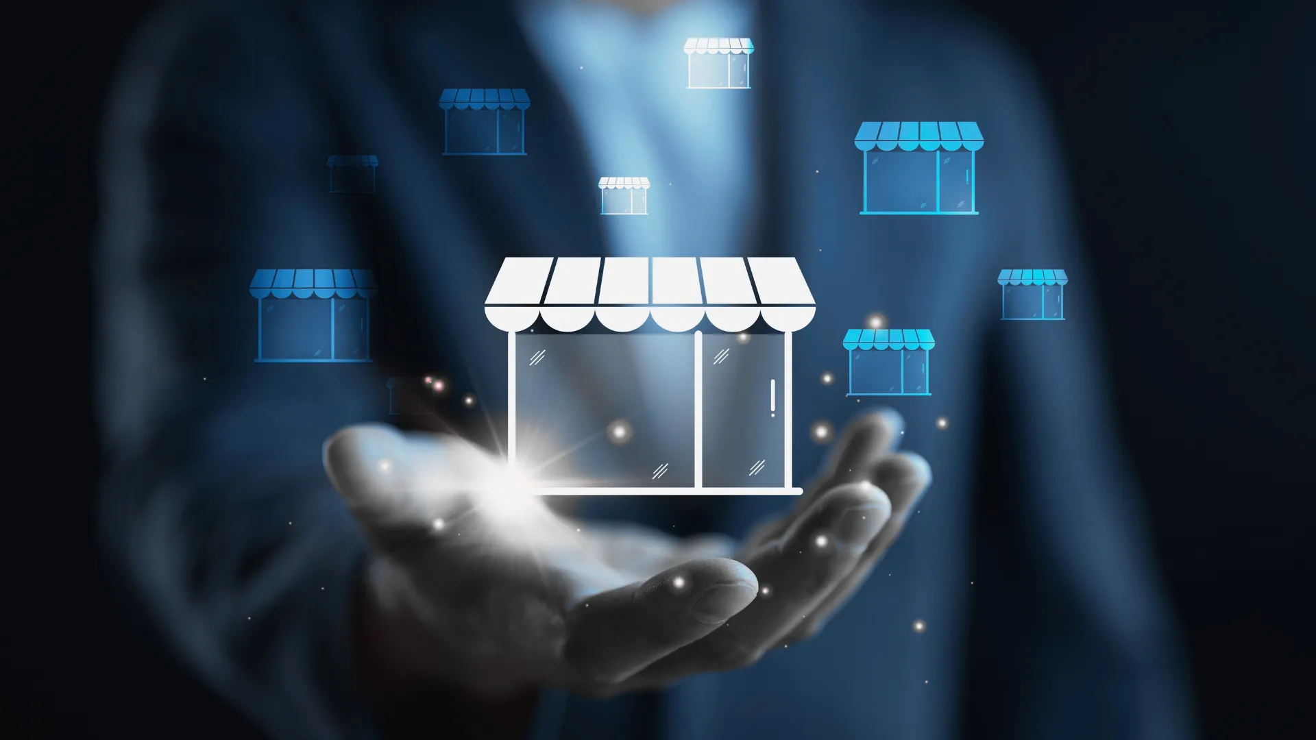 Image of building outline hovering over person's hand