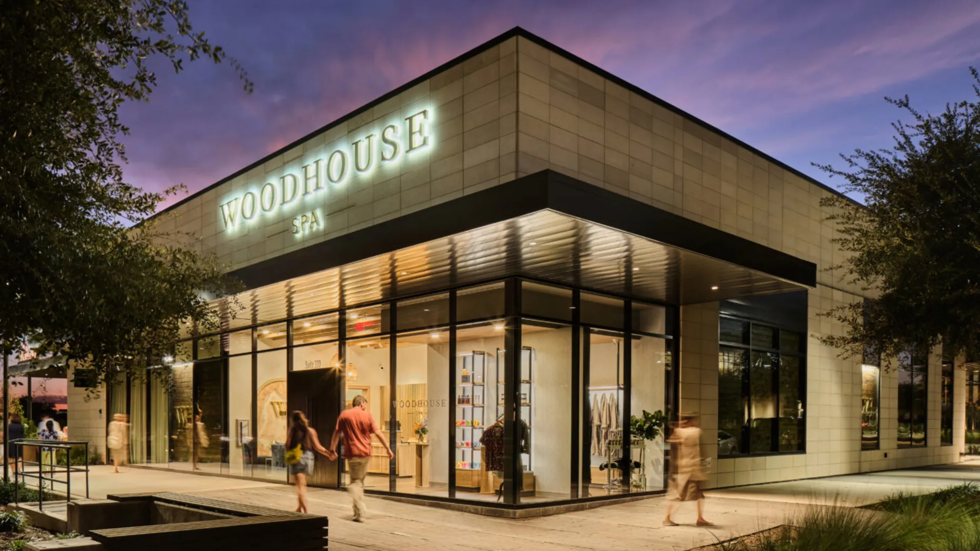Photo of exterior of Woodhouse Spa location with people walking around outside