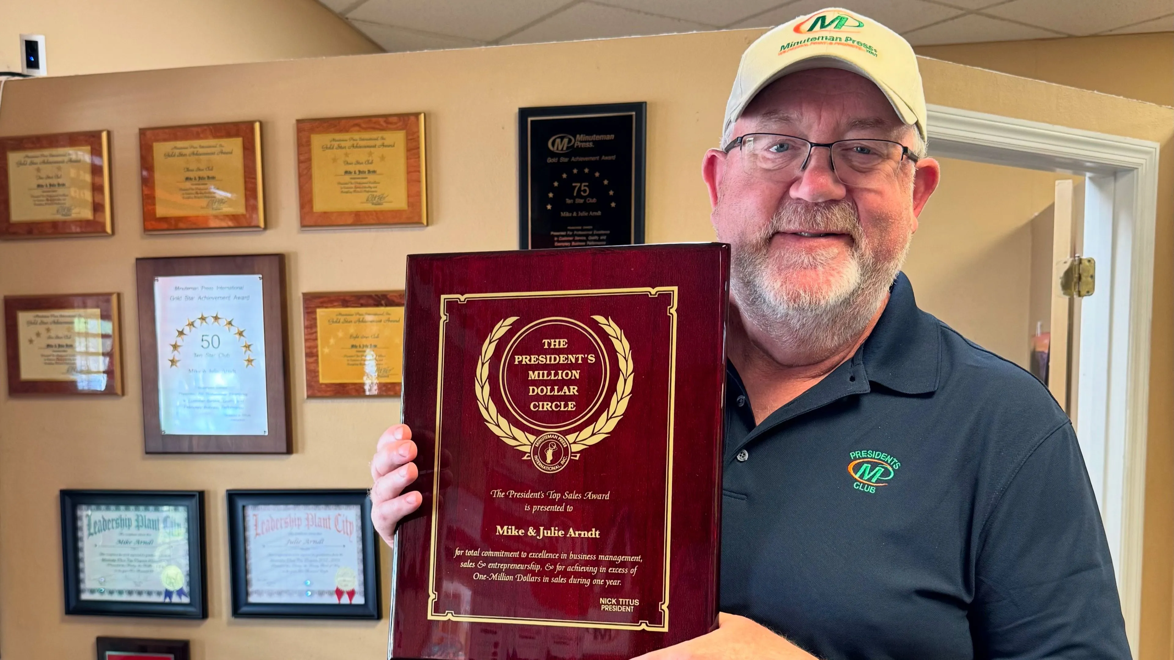 Minuteman Press Franchise Owner Mike Arndt with his President’s Club Award in Plant City, FL.