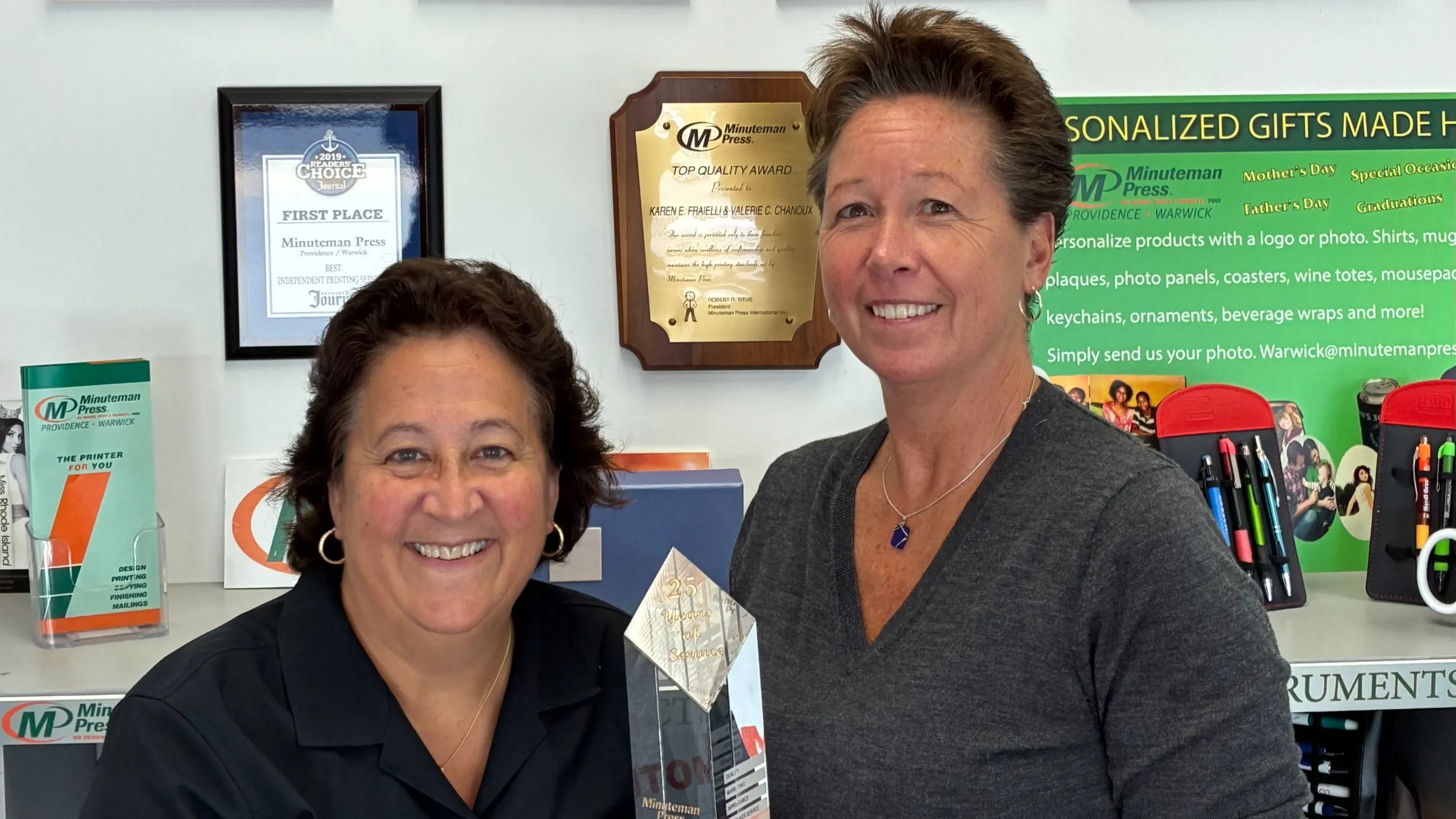 Minuteman Press franchise owners Karen Fraielli and Valerie Chanoux with their 25-year Award.