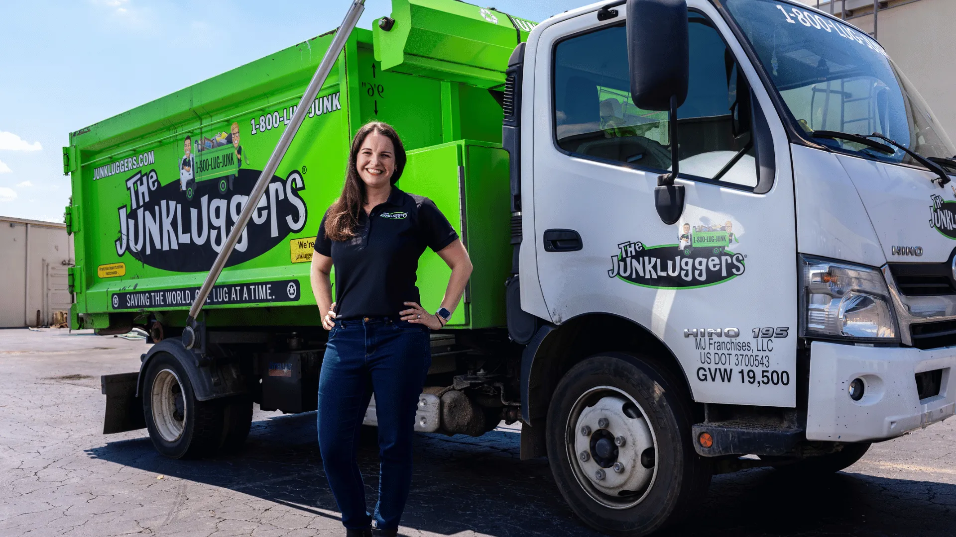 image of a junkluggers franchise owner franchisee standing in front of a company truck succesful
