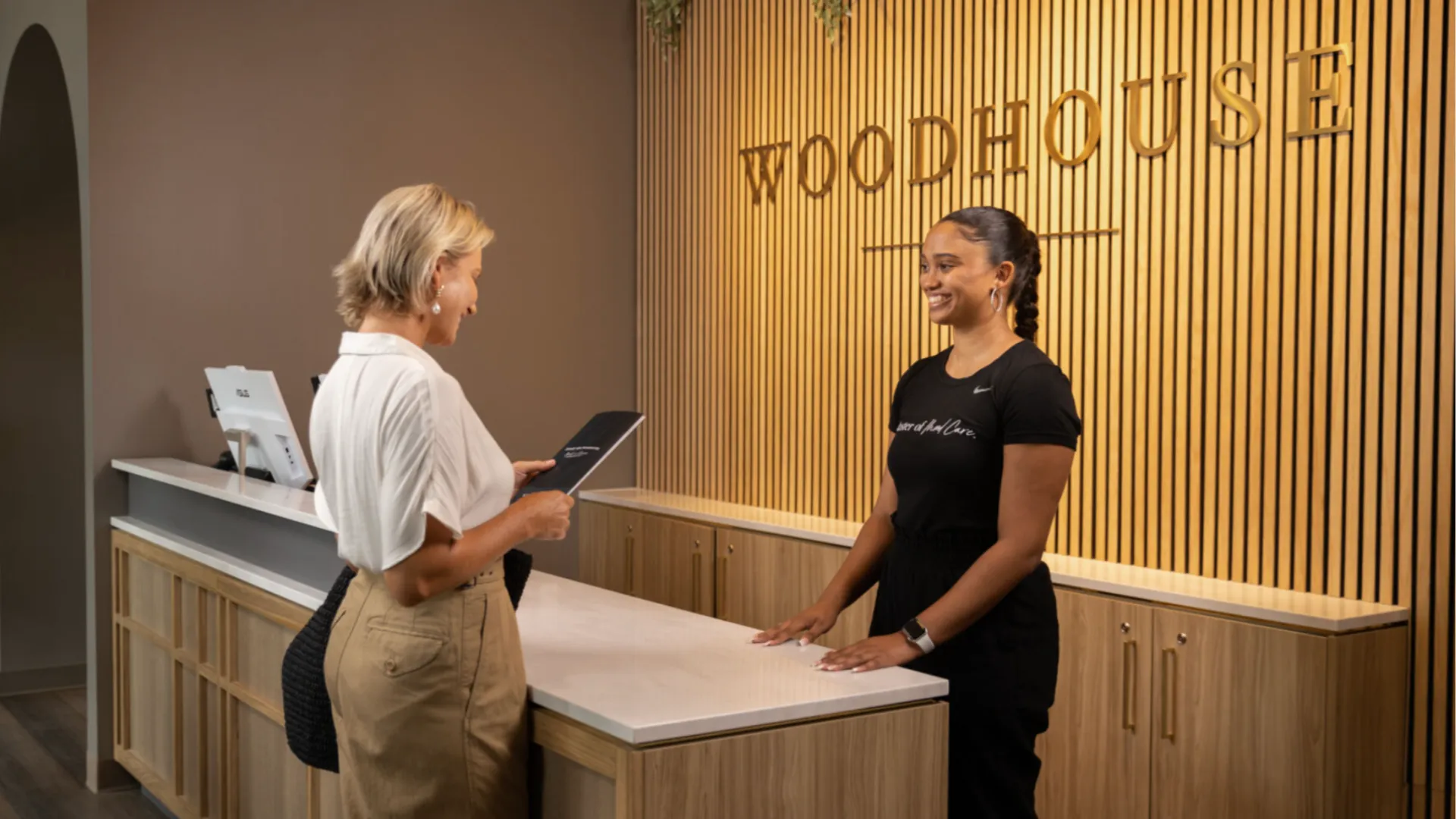 Photo of guest checking in at Woodhouse Spas reception desk