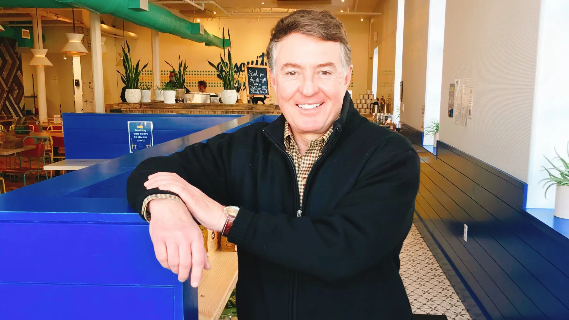 Photo of Chuck Schnatter inside Biscuit Belly location