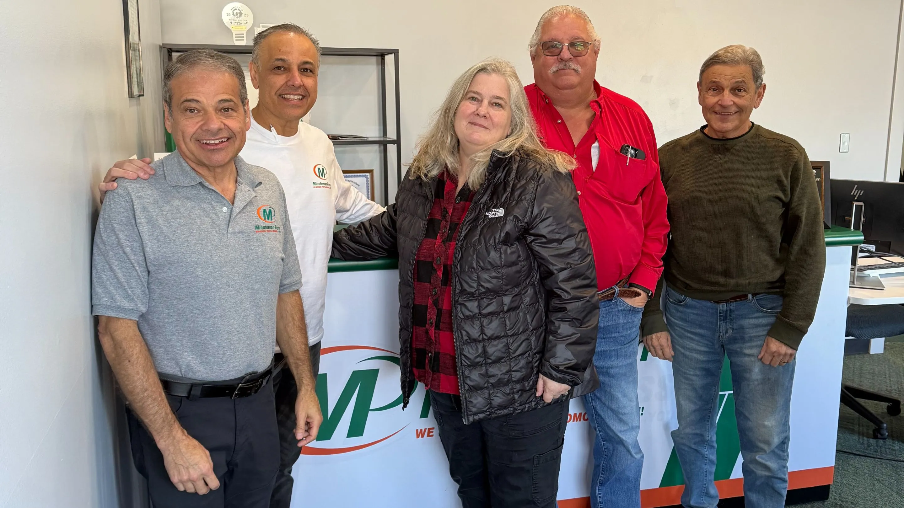 Minuteman Press franchise, Lansing, MI. Pictured L-R: Paul, Val, Cary, Lyle, and Greg.