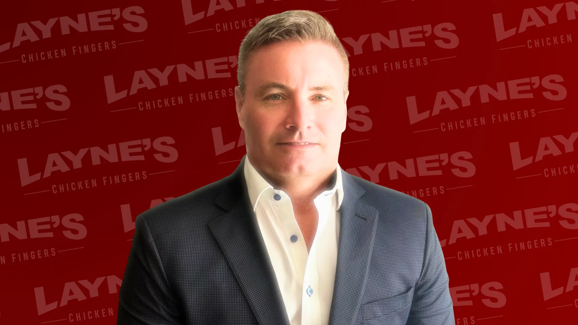 Photo of Layne's, Arby's franchisee Doug McGuire with Layne's Chicken Fingers logo