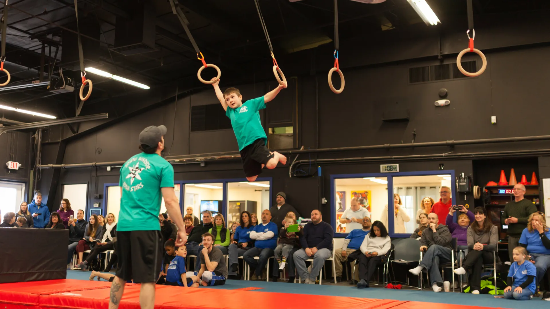 Photo of child and coach participating in USA Ninja Challenge class