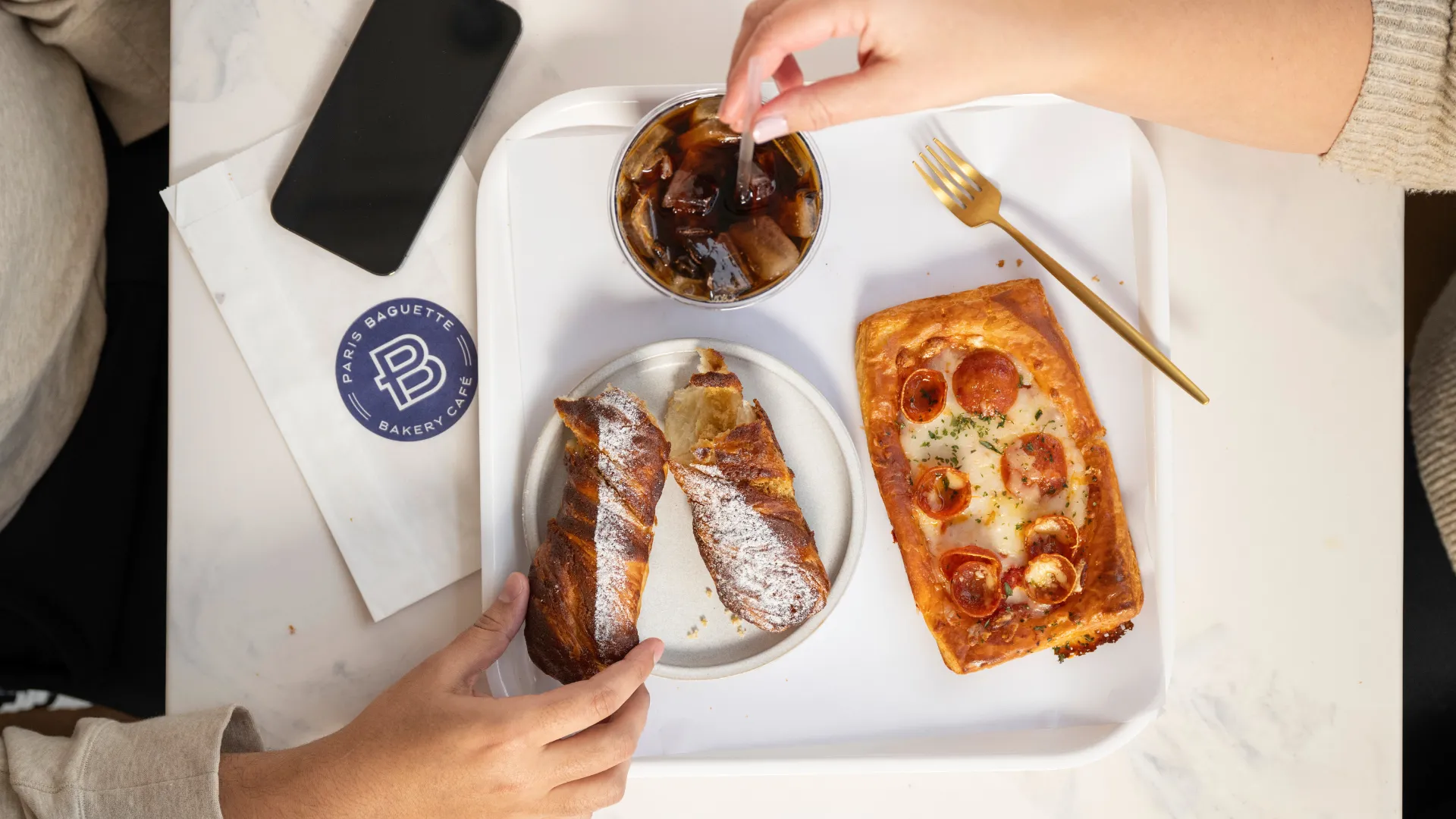 Photo of tray with Paris Baguette food and iced coffee