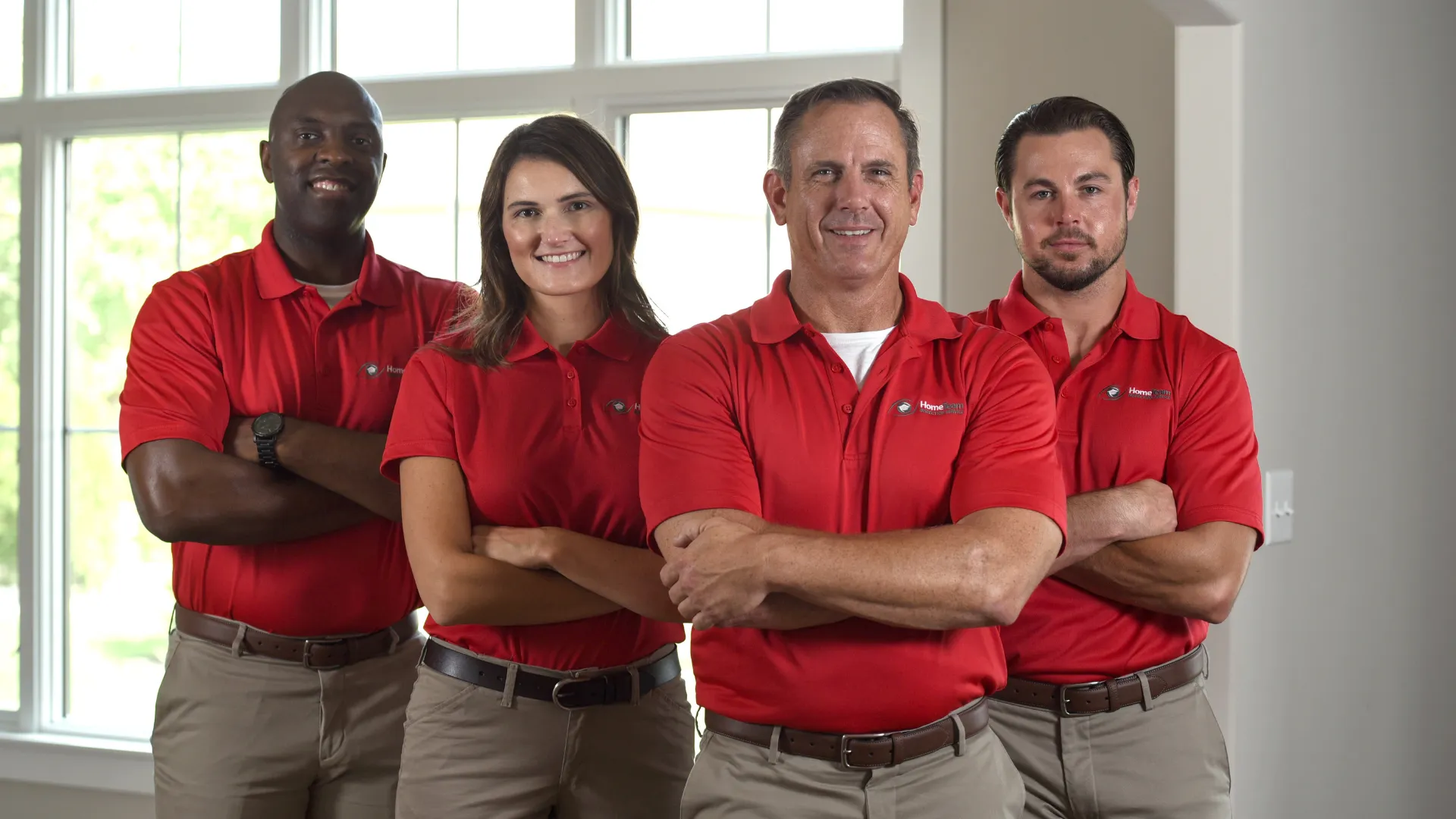 Photo of multiple HomeTeam inspectors standing together