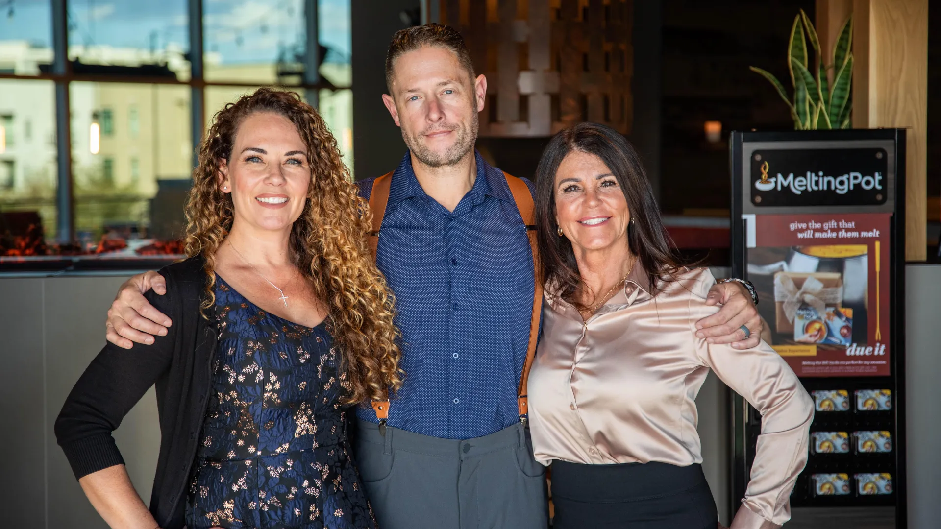 Photo of Melting Pot franchise owners Candice and Chad Hickerson and Diana Bonnett