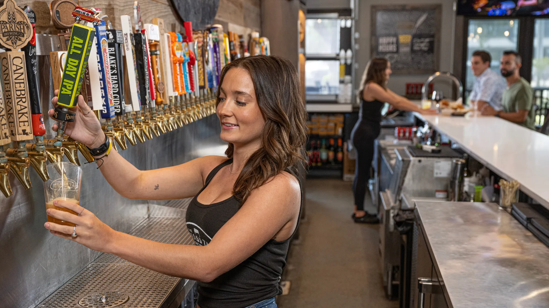 image of the brass tap franchise bartender serving drinks