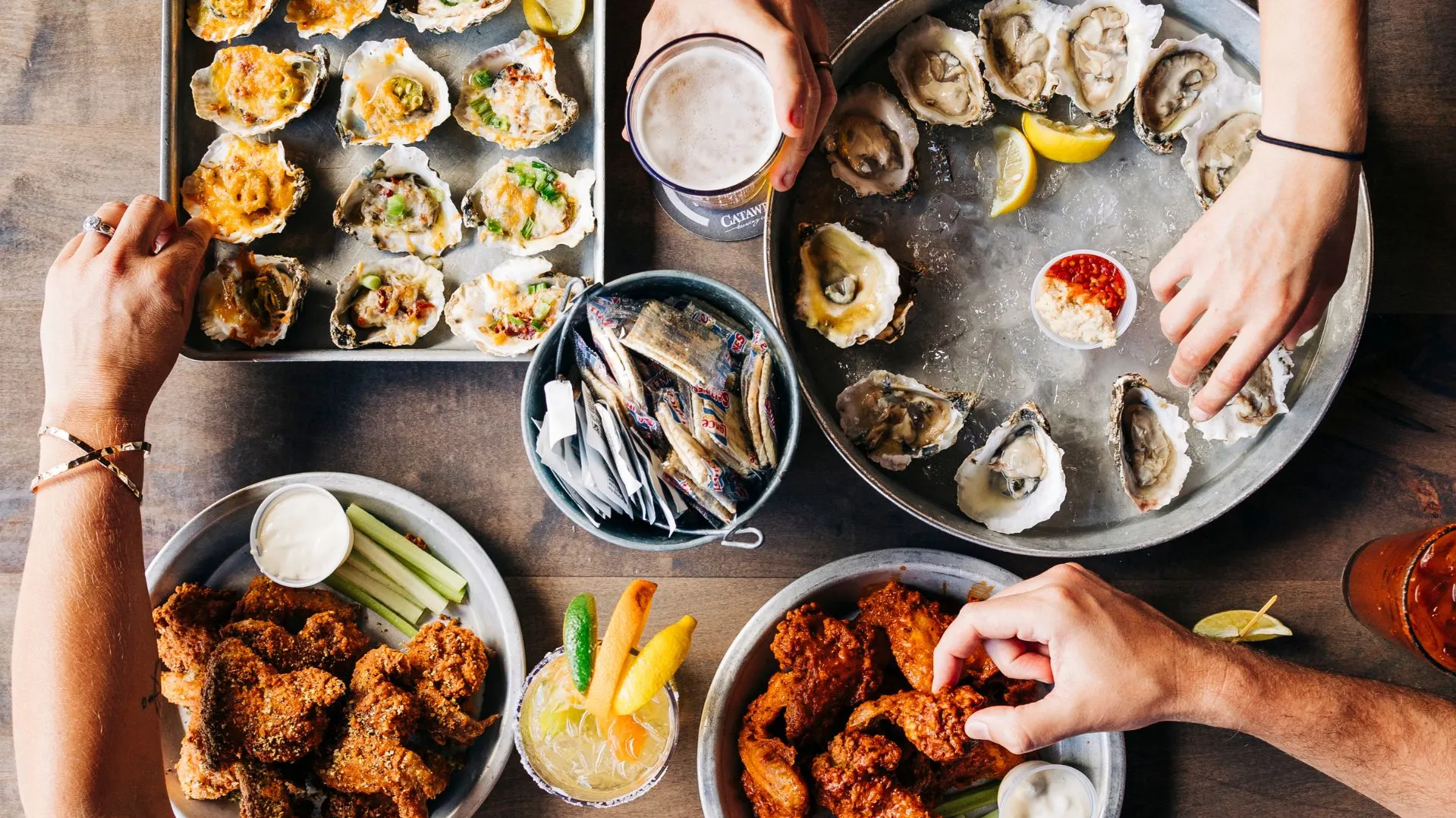 Photo of Shuckin' Shack platters and beverages on table