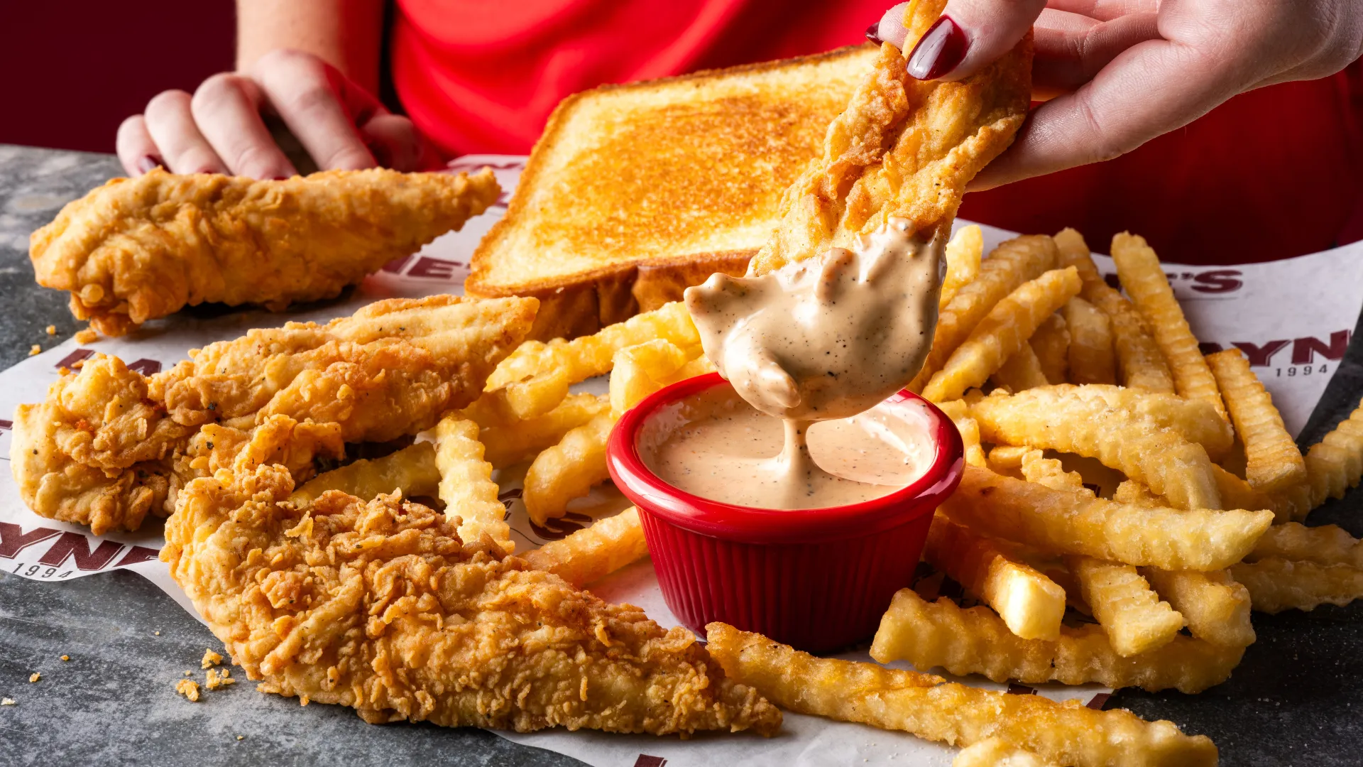 Photo of Layne's Chicken Fingers tenders, fries, toast and sauce
